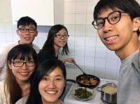 Erwin (right) cooking with friends at hostel